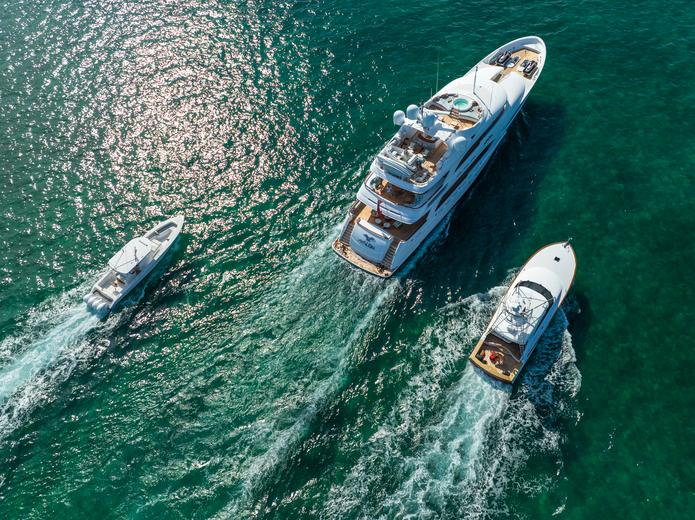 Overhead aerial of Motor Yacht Avalon underway with tenders running alongside
